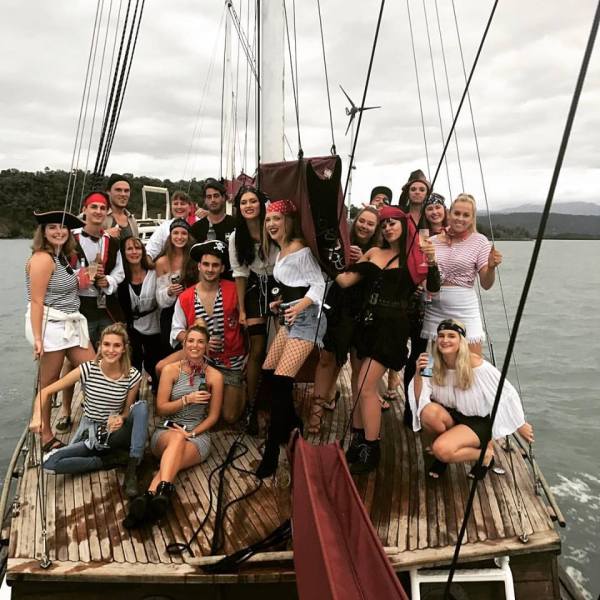 people in pirate costumes on shaolin junk boat