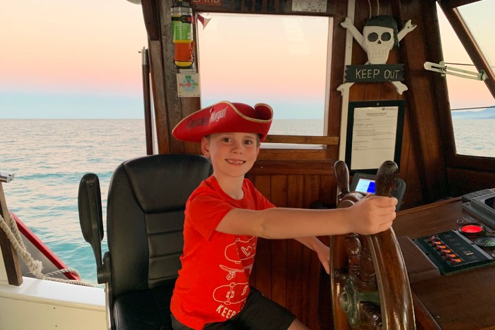 a person standing in front of a body of water