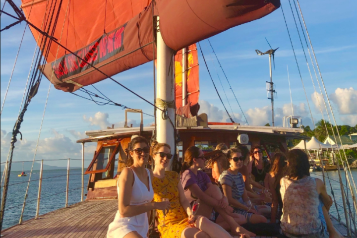 a group of people in a boat on a body of water