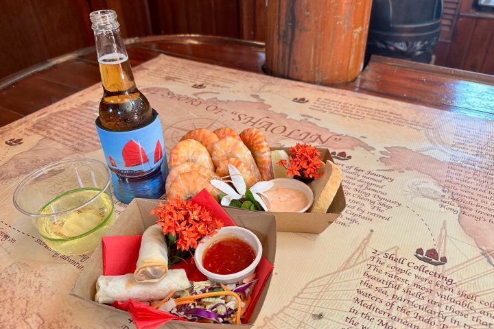 a plate of food with a glass of wine