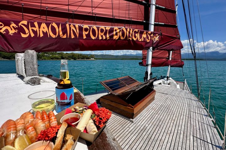 a group of people on a boat in the water