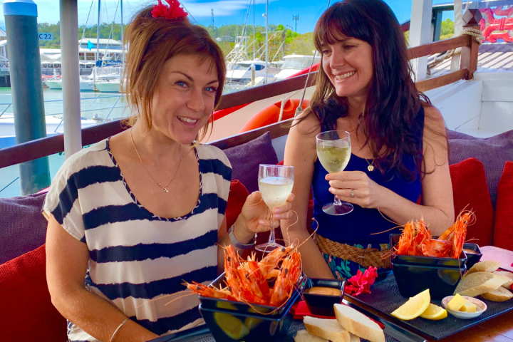 a woman sitting at a table eating food
