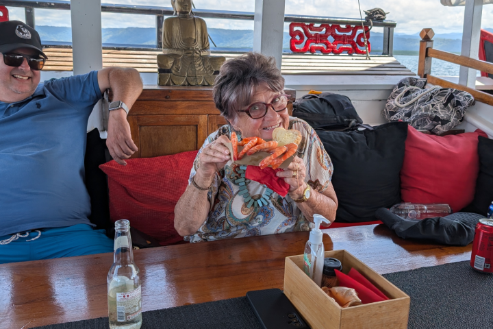 a person sitting at a picnic table