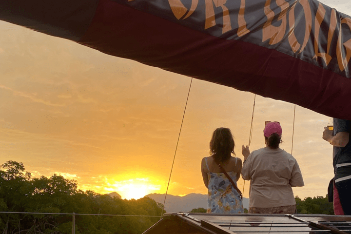 a person flying through the air while holding an umbrella